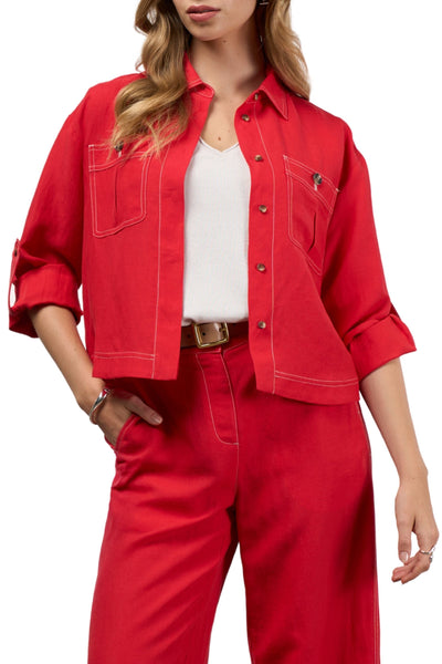 Person wearing a red jacket and pants with a white top on a white background