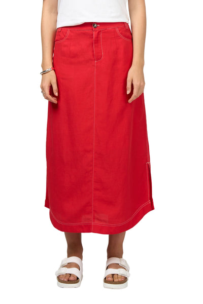 Red skirt worn by a person on a white background