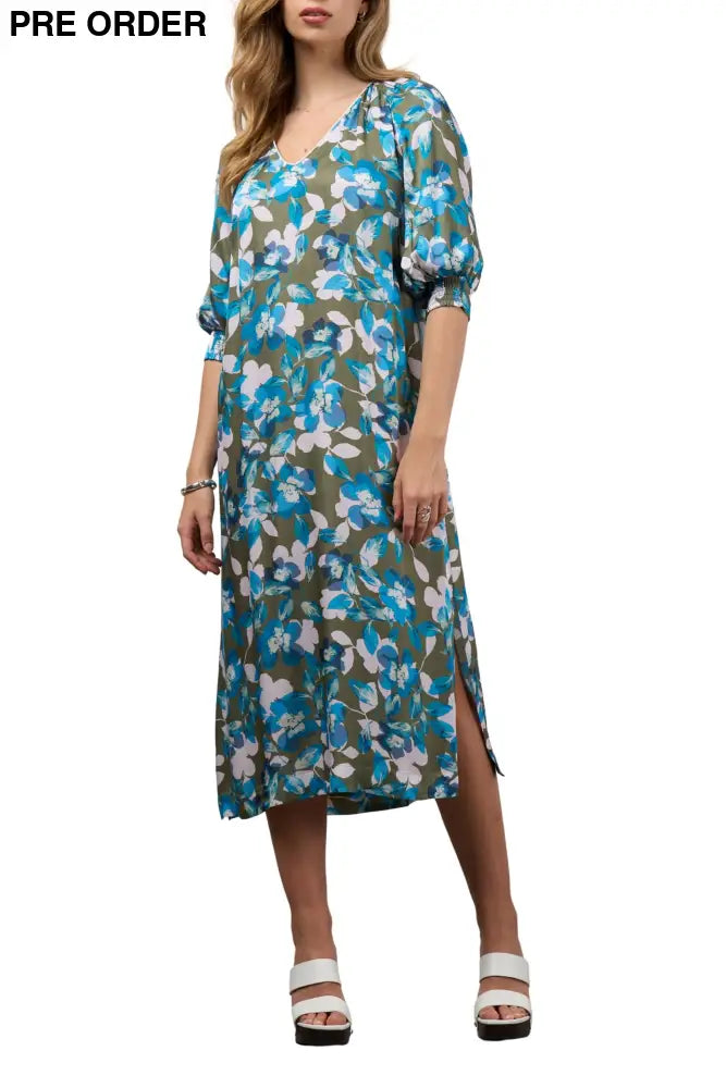 Woman wearing a floral dress on a white background